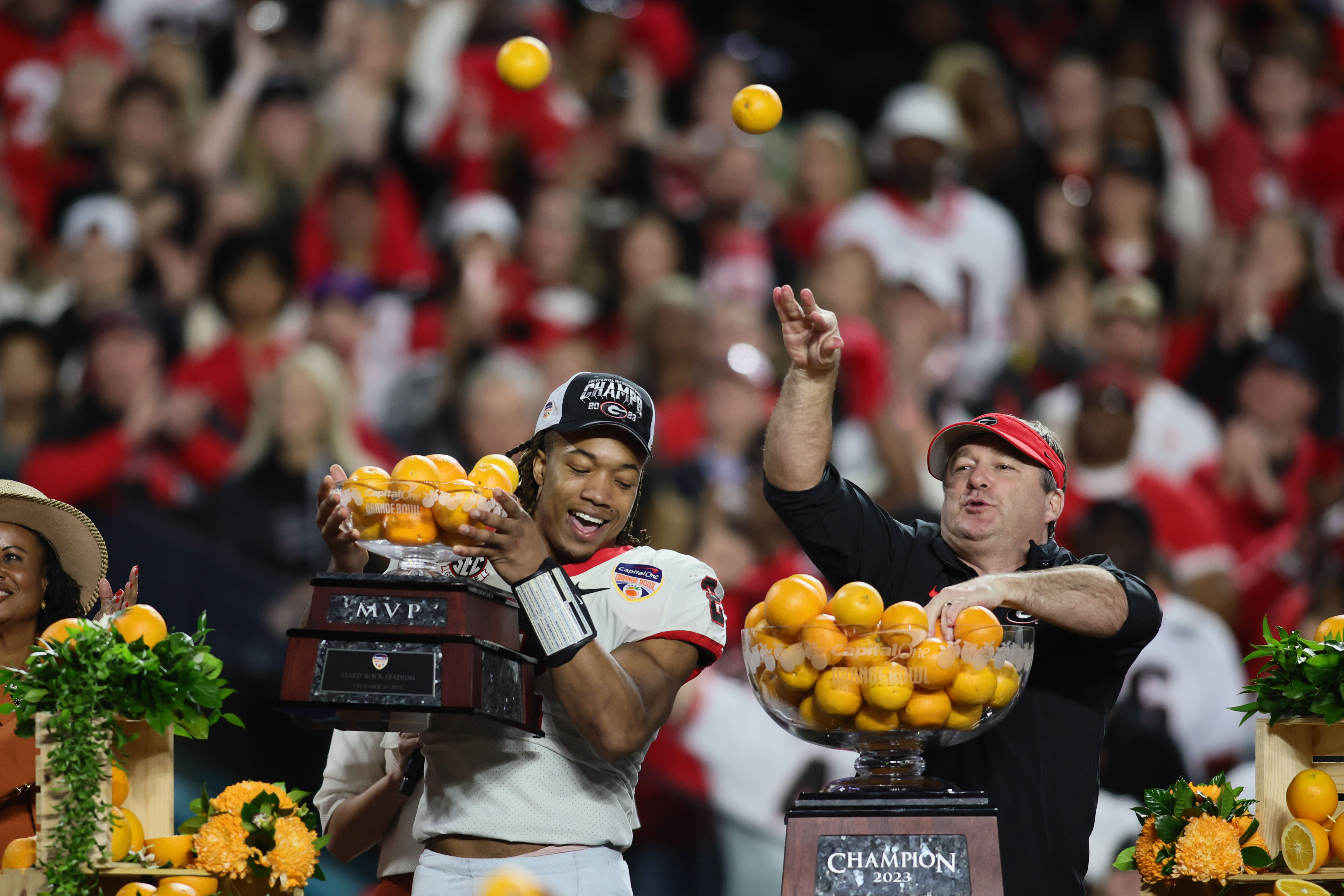 Dec 30, 2023; Miami Gardens, FL, USA; Georgia Bulldogs head coach Kirby Smart and running back Kendall Milton (2) react after the 2023 Orange Bowl at Hard Rock Stadium. (Sam Navarro / USA TODAY Sports).